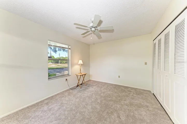 Guest bedroom.  Window is looking out at the street