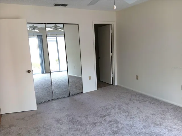 Master bedroom.  Closet is behind the mirrors on the left.