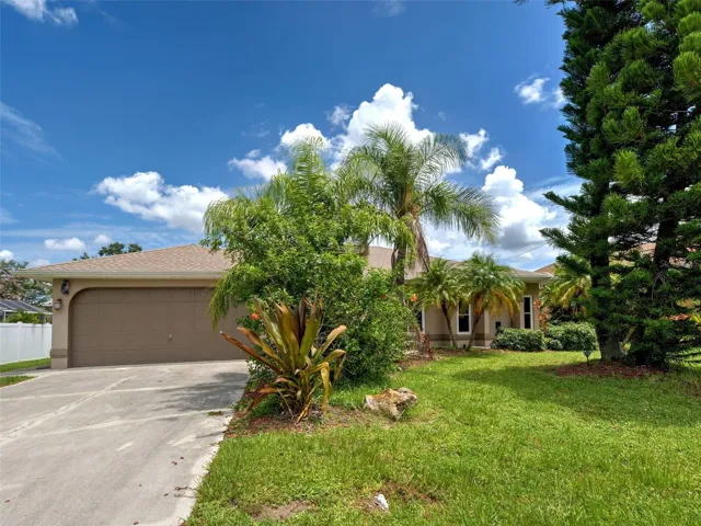 Stunning Florida style home on a lot with mature landscaping.