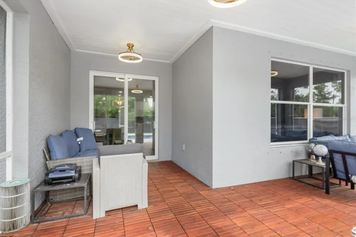 L-shaped space accommodates table, chairs and sofas.