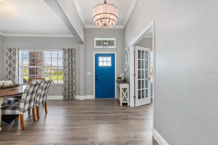 Entrance hallway, note the luxury vinyl flooring throughout the home.