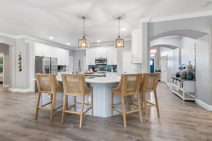 Room to sit around the kitchen countertop.
