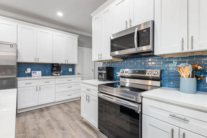 Stainless steel appliances in kitchen.
