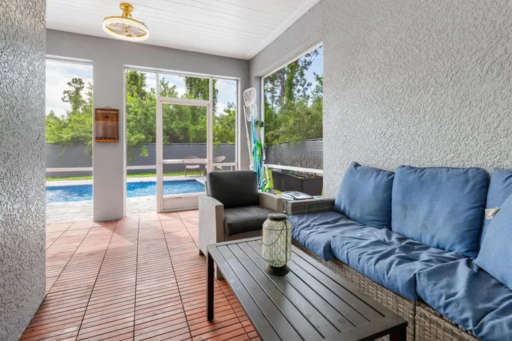 Covered lanai overlooking pool.