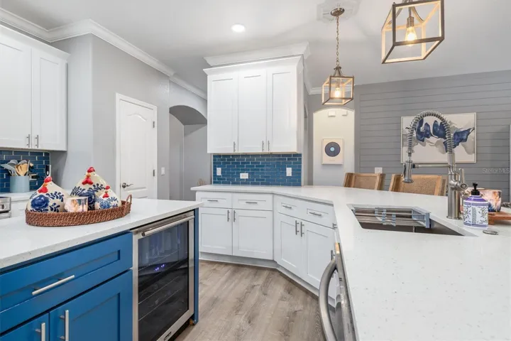 Wine refrigerator in kitchen island will stay for Buyer.