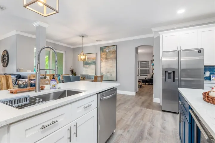 Kitchen has openings to family room, dinette and formal dining room.