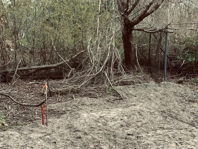 NW Property Corner and partial cyclone fence S of property line