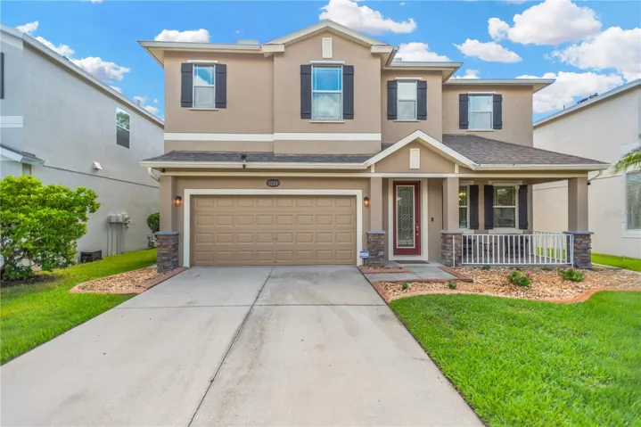Front elevation. Freshly painted, stone accents, beautiful landscaping and curb appeal!