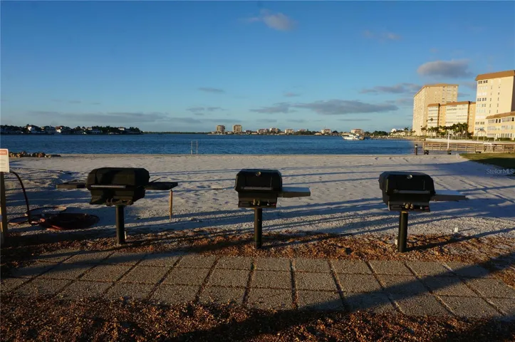 Grills and a little sandy spot