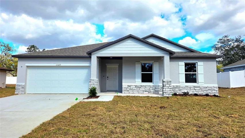 Exterior with front porch and stone accent