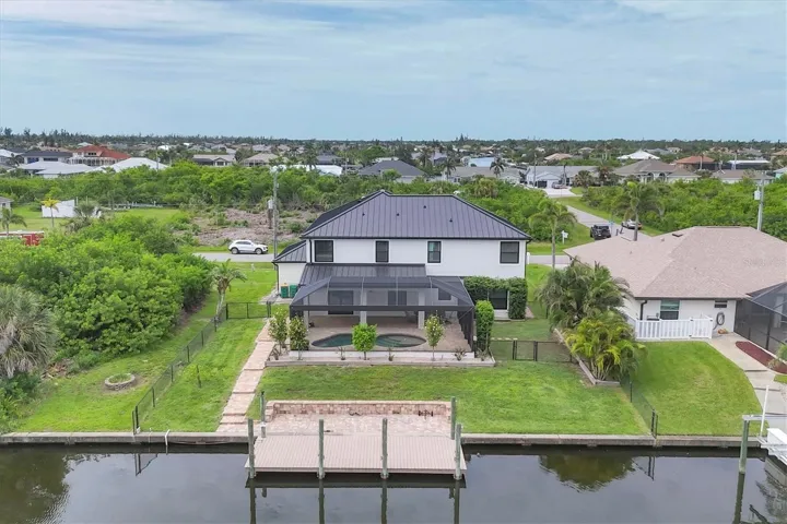 aerial of rear exterior canal front and dock