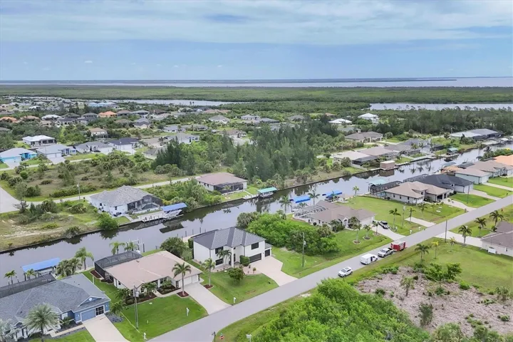 aerial showing street, canal and Lagoon beyond rear of photo and beyond Lagoon Myakka River