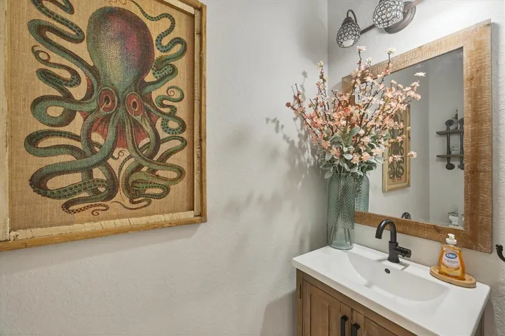 from entry hall to kitchen this 1/2 bath located central to both