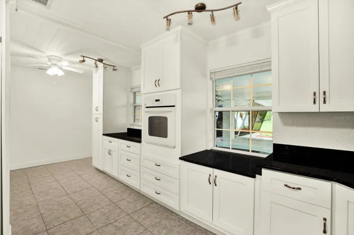 Pass thru window to screened patio for entertaining