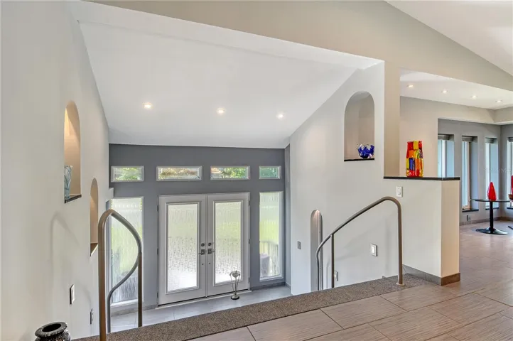 An open and airy entryway welcomes you with clean lines and a seamless flow that sets the tone for the modern, sophisticated living.