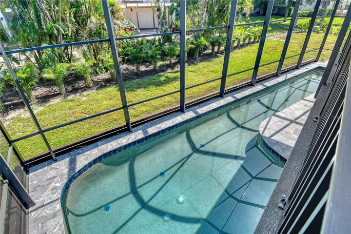The sweeping pool embodies coastal luxury, offering ample space to swim, play, and unwind in style.