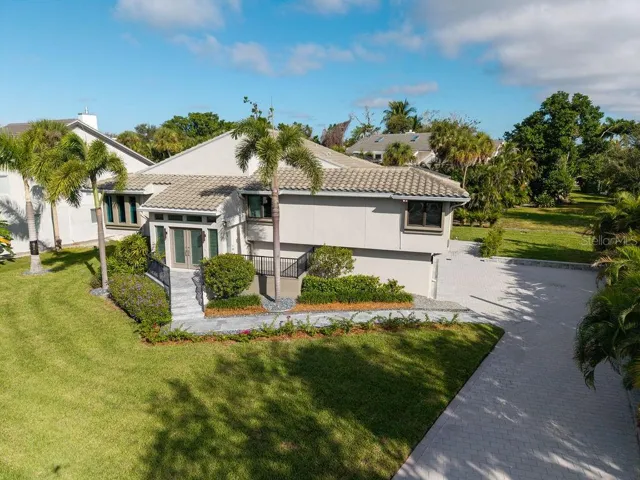 This home is nestled in The Bayou neighborhood within the exclusive, double gated Bay Isles community offering exceptional privacy and security.