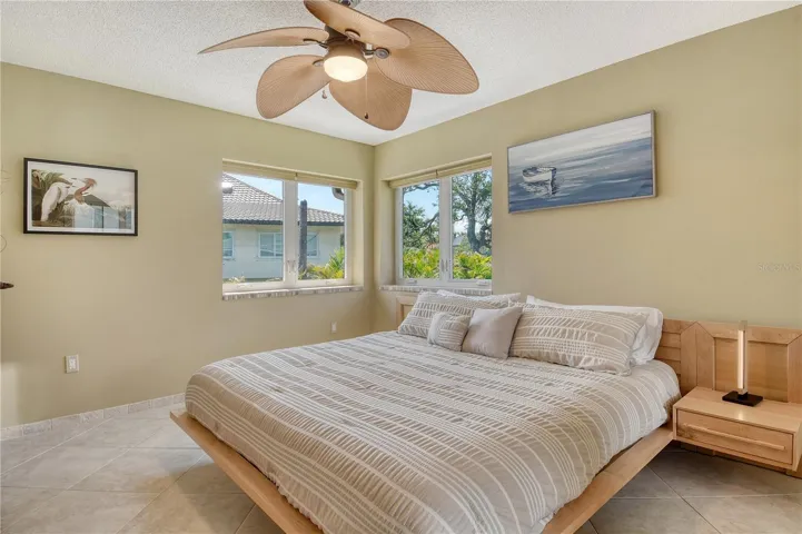 The second bedroom is generously sized and warmly inviting.