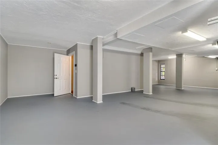 The three car garage is impressively clean and well maintained, providing ample area for vehicles, storage, and hobbies.