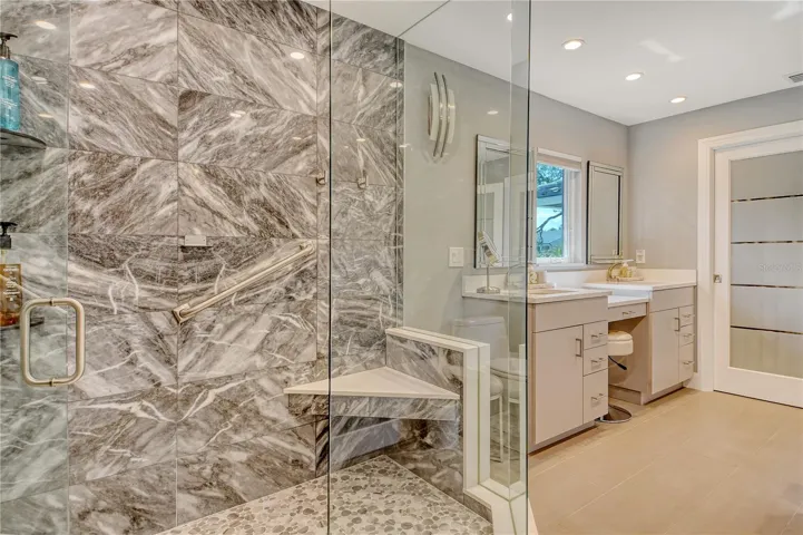 Double sinks and countless upgraded details make this primary bath even more desirable.