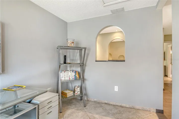 The third bedroom has been thoughtfully transformed into a stylish home office areal and a full laundry room, offering both functionality and versatility.
