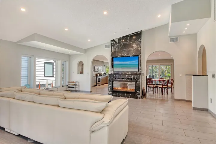 Family room is filled with abundant natural light opening to other areas of the home.