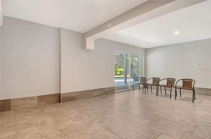 The expansive lower level is non conforming living space.  Current owner has this finished family room area leading to patio and pool area.