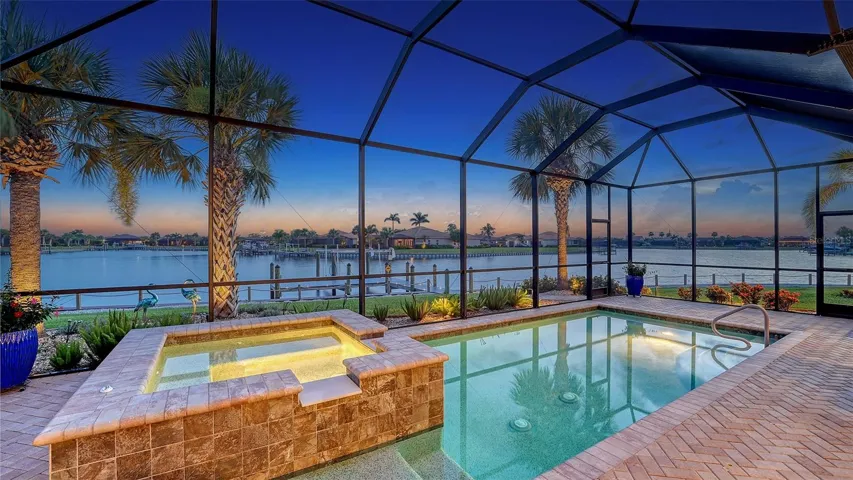 Private backyard oasis with views of the lake framed with sunset views.