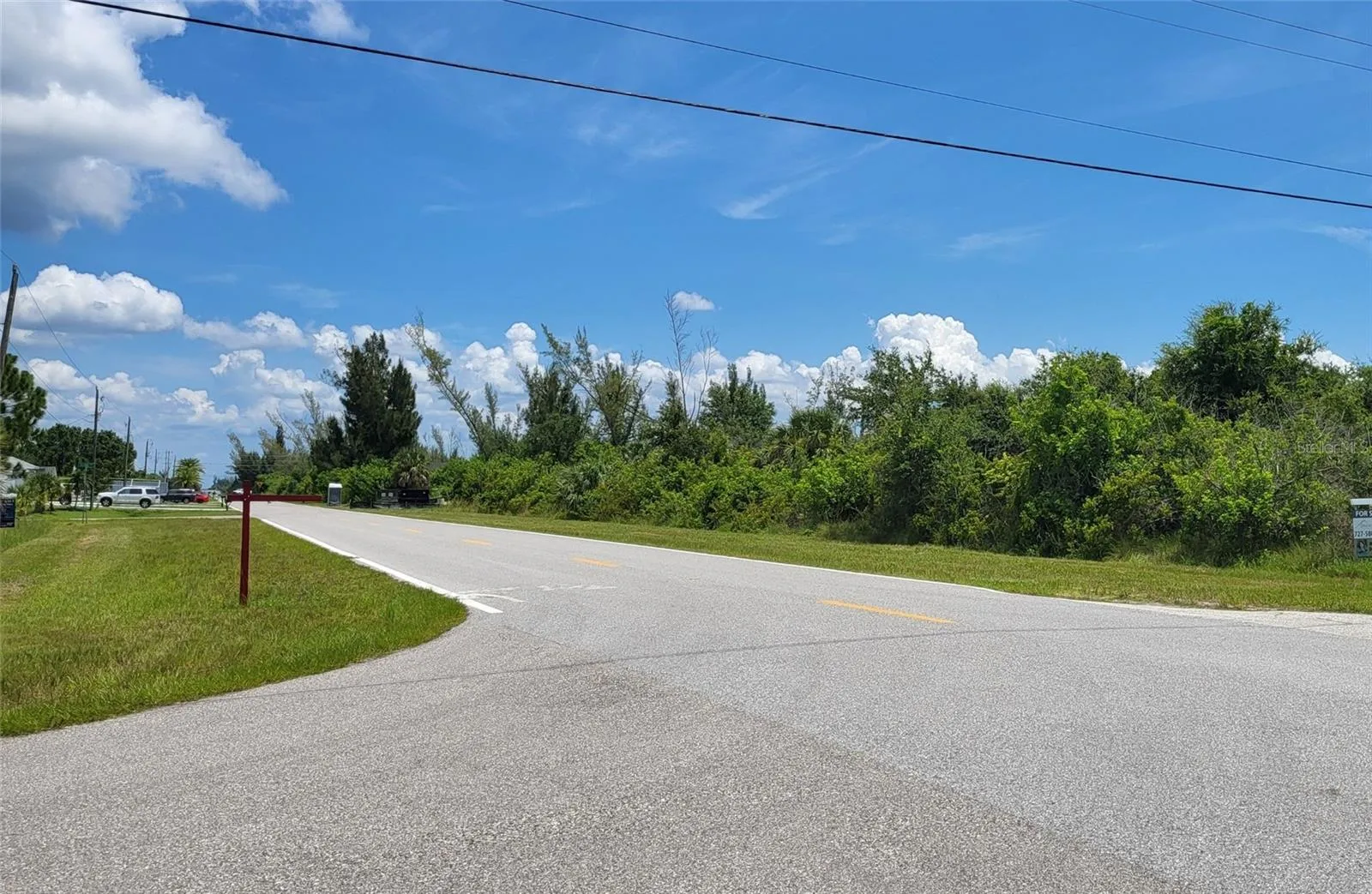 Homes nearby. Public water, sewer, and power available.