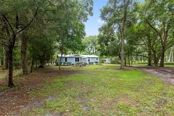 2 acre compound with 3 homes and 4 accessory structures