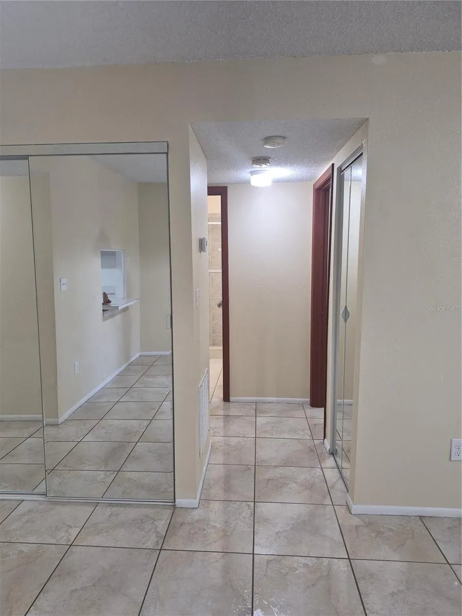 View from dining to bedrooms and bathroom