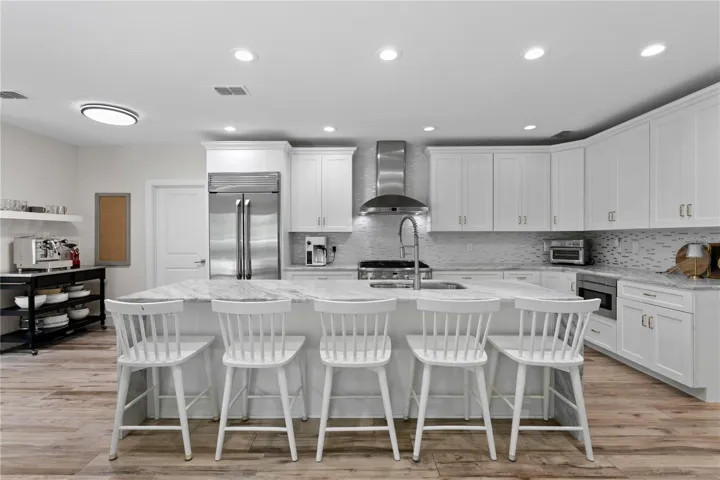 Boasting an oversized island with abundant cabinetry and ample seating options...this kitchen has it all!