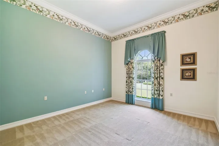 The Magnolia bedroom features a generous closet, an en-suite full bathroom, and direct access to the hallway.