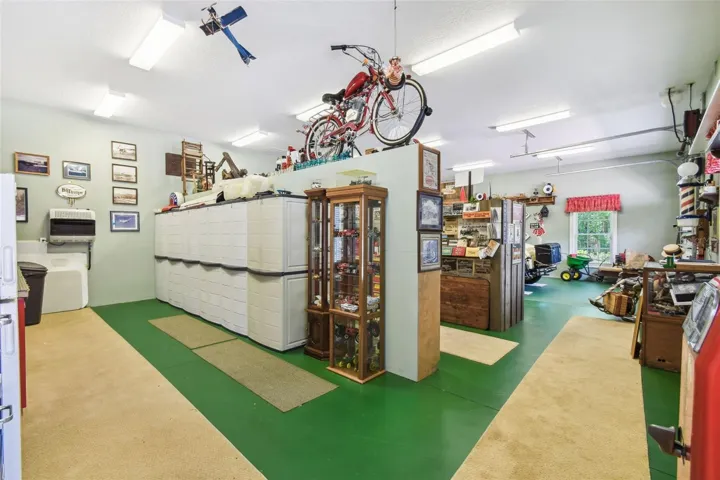 Inside the carriage house, you'll find a personal museum and country store—a spacious area perfect for showcasing your favorite collectibles, memorabilia, or themed displays.