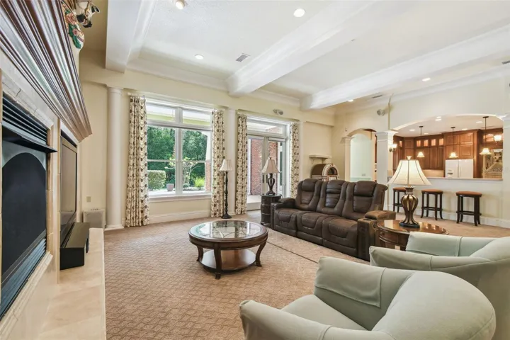 mpressive grand room features a gas fireplace, custom built-ins, surround sound, and a one-of-a-kind original carousel house centerpiece that adds character and charm.