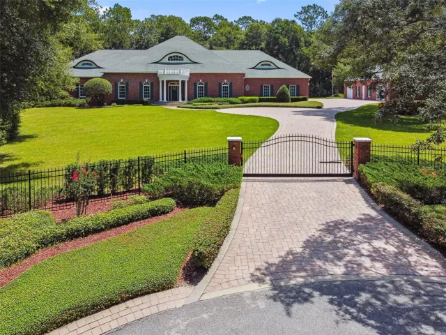 Welcome home to this custom-built private estate, nestled on 2.5 acres at the end of a peaceful cul-de-sac. Surrounded by mature landscaping, fencing, and lush green buffers, it offers exceptional privacy and tranquility.
