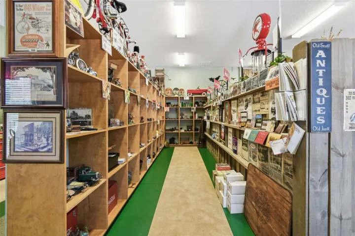 Inside the carriage house, you'll find a personal museum and country store—a spacious area perfect for showcasing your favorite collectibles, memorabilia, or themed displays.