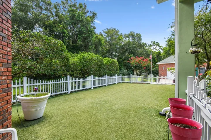 The dog park is a fantastic space to unwind and enjoy quality time with your furry friends. Partially covered by a roof, the entire area features durable artificial turf and secure fencing, creating a safe and welcoming environment for your pets. A ceiling fan in the covered section keeps things cool, while exterior lighting ensures the space is usable even after sunset.