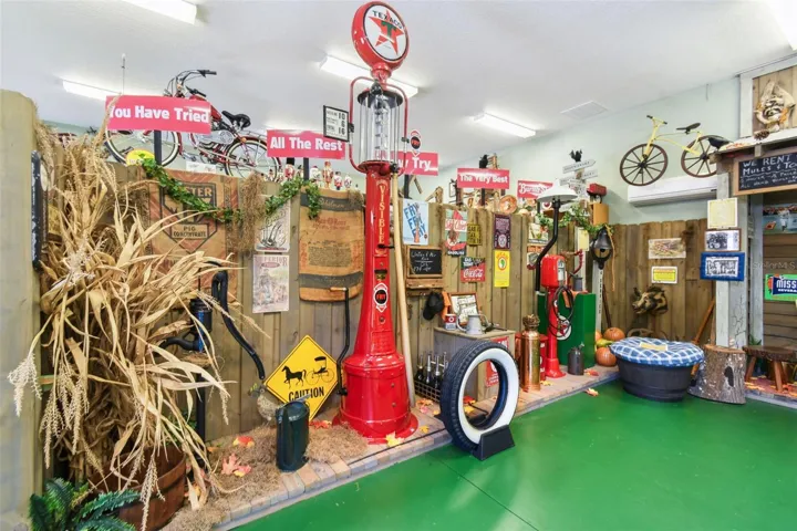 Inside the carriage house, you'll find a personal museum and country store—a spacious area perfect for showcasing your favorite collectibles, memorabilia, or themed displays.