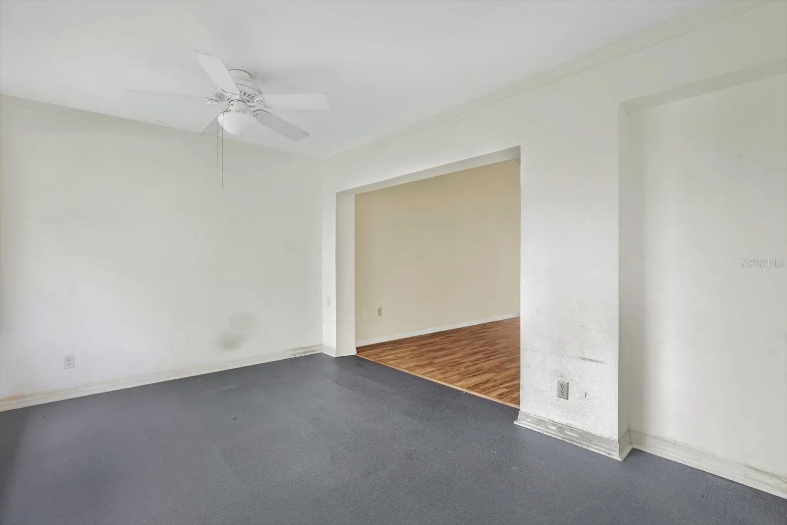 The foyer just inside the front door, with a clear sightline through to the living area.
