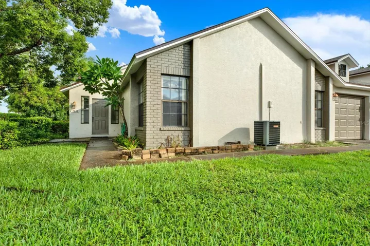Front exterior of this 2-bedroom, 2-bath villa at 7636 Haig Court in Ruxton Village, New Port Richey. New roof installed May 2026.