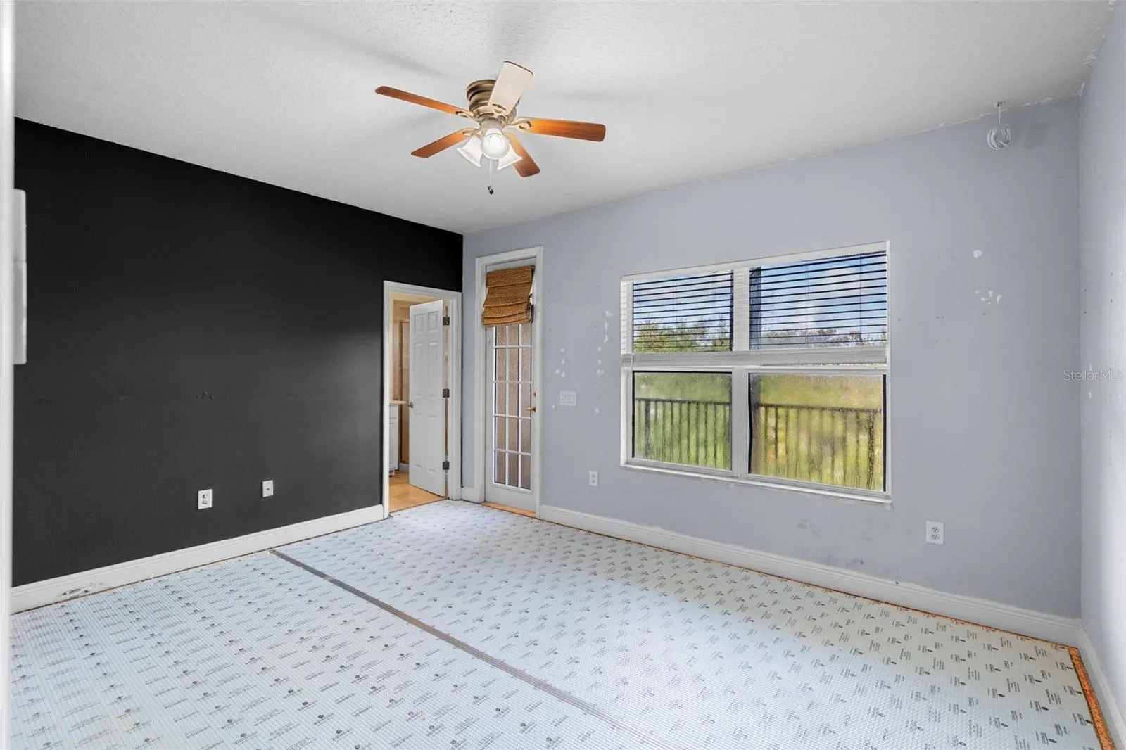 Primary bedroom with its own balcony