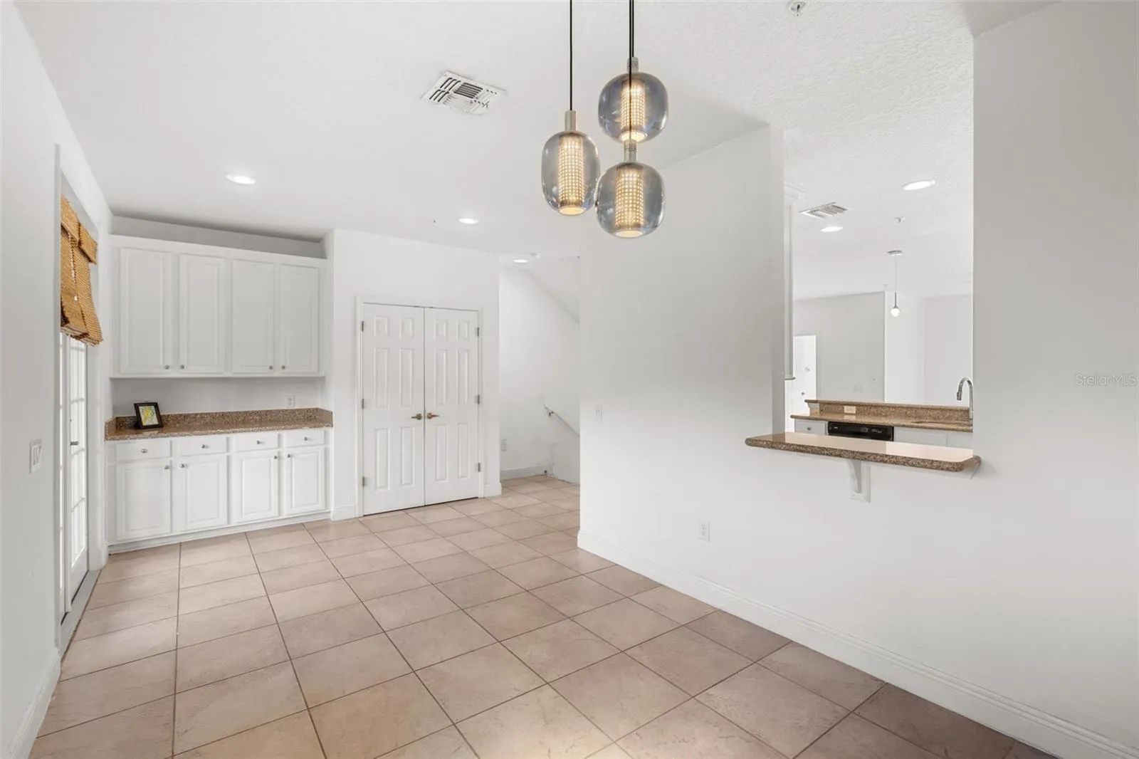 Dry bar with more storage and a pass-through bar to kitchen