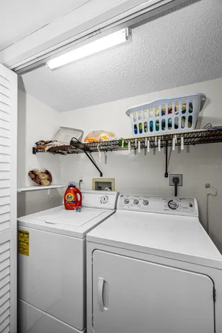 Inside laundry closet near bedrooms 2 and 3.