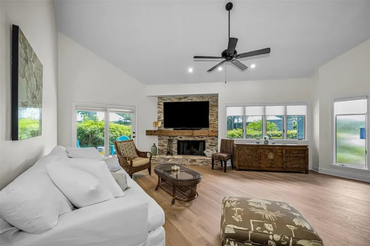 Living room, new flooring,fresh paint, plus gorgeous stacked stone wood burning fireplace and so much natural light!
