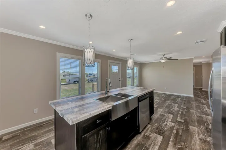 STANDING AT THE FRONT WINDOW LOOKING BACK INTO THE KITCHEN, LIVINGROOM SHOWS THE HALLWAY TOWARDS THE TWO BEDROOMS.
