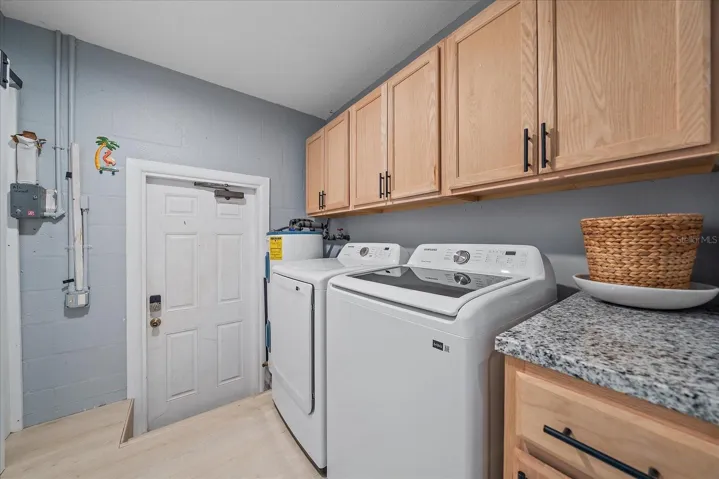 laundry room HWH, Washer and dryer 7/25, barn doors cover closetopenings