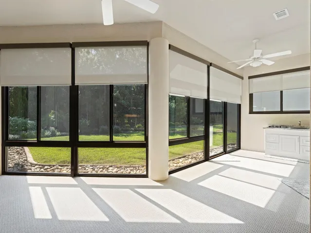 Relaxing Florida Room with shades, fans, AC and summer kitchen