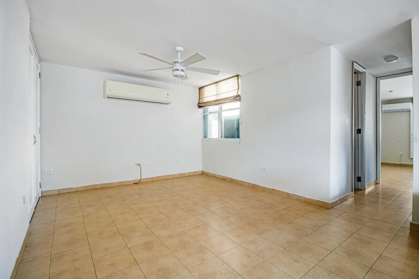 This space in the living room could be converted into a third room by building a wall, it has a closet and window.