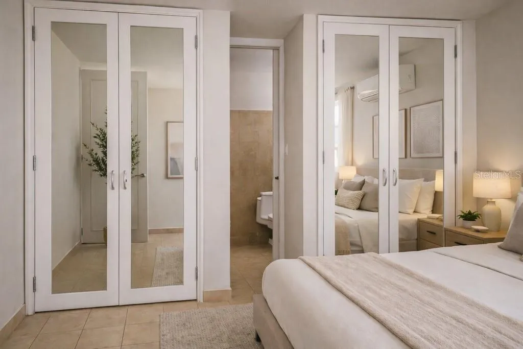 Primary Bedroom: Spacious primary bedroom with mirrored closets and ensuite bath. AI-generated/AI-enhanced image for illustrative purposes.